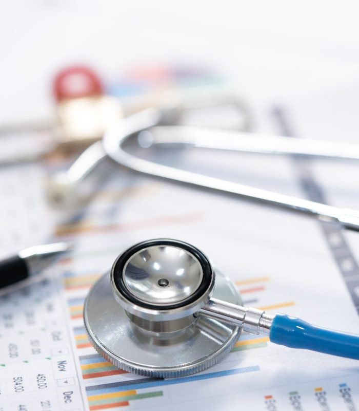 Stethoscope and Charts , Saving stack coins money, globe and credit card. Finance, Account, Statistics, Investment, Analytic research data economy and Business company meeting concept.